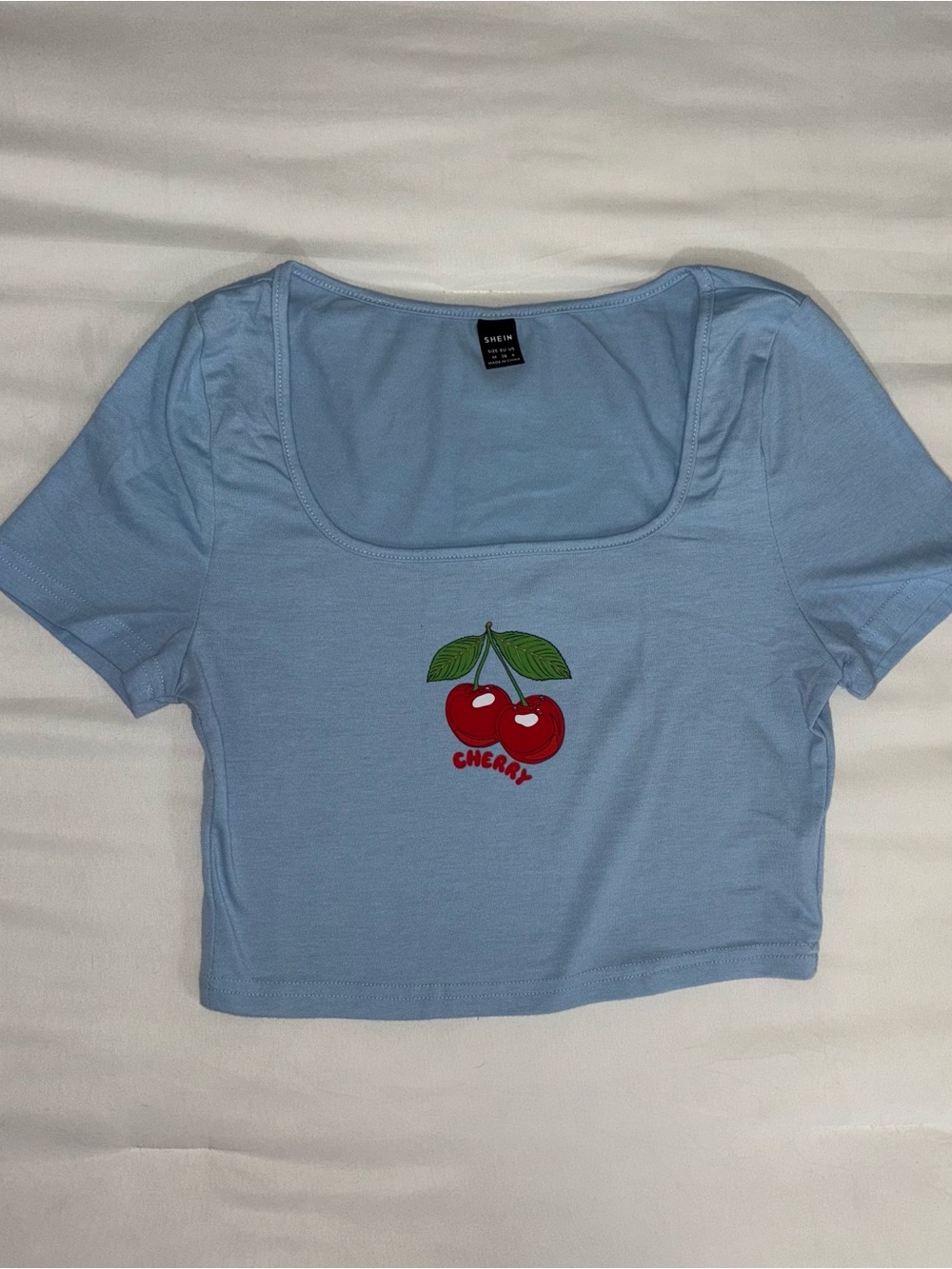 SHEIN Light Blue Crop Top with Red Cherry Graphic